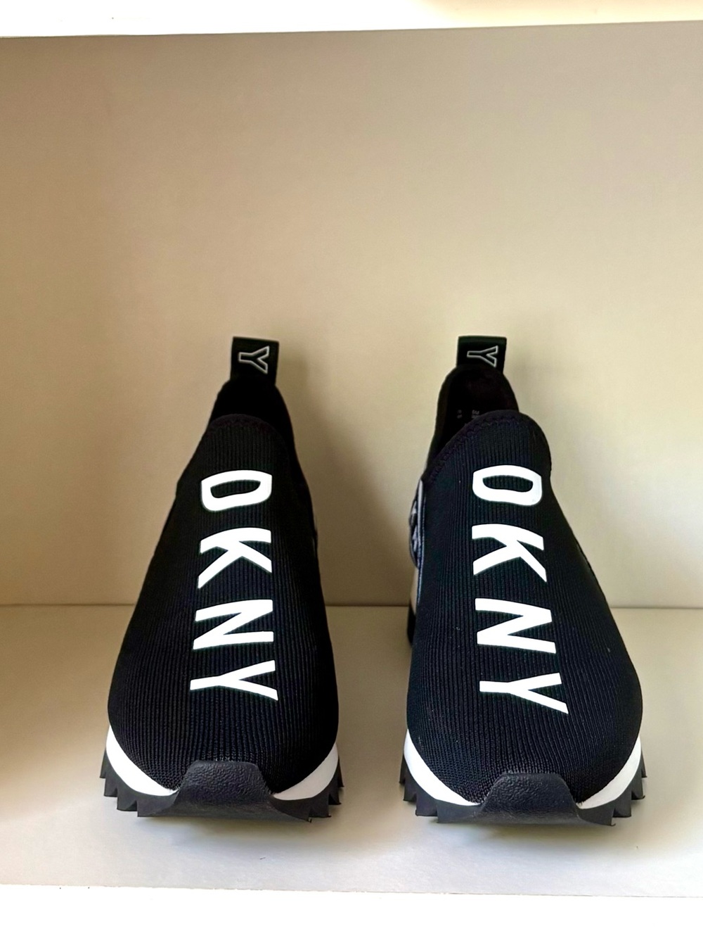 DKNY Women’s Black Slip-On Sneakers with White Logo